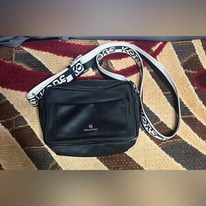 Michael Kors Black Logo Mini Nylon Crossbody Bag with Webbing Strap.